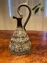 Carafe ou verseuse à décor de frises en céramique, époque art déco.                 Carafe or jug decorated with ceramic friezes, art deco period.