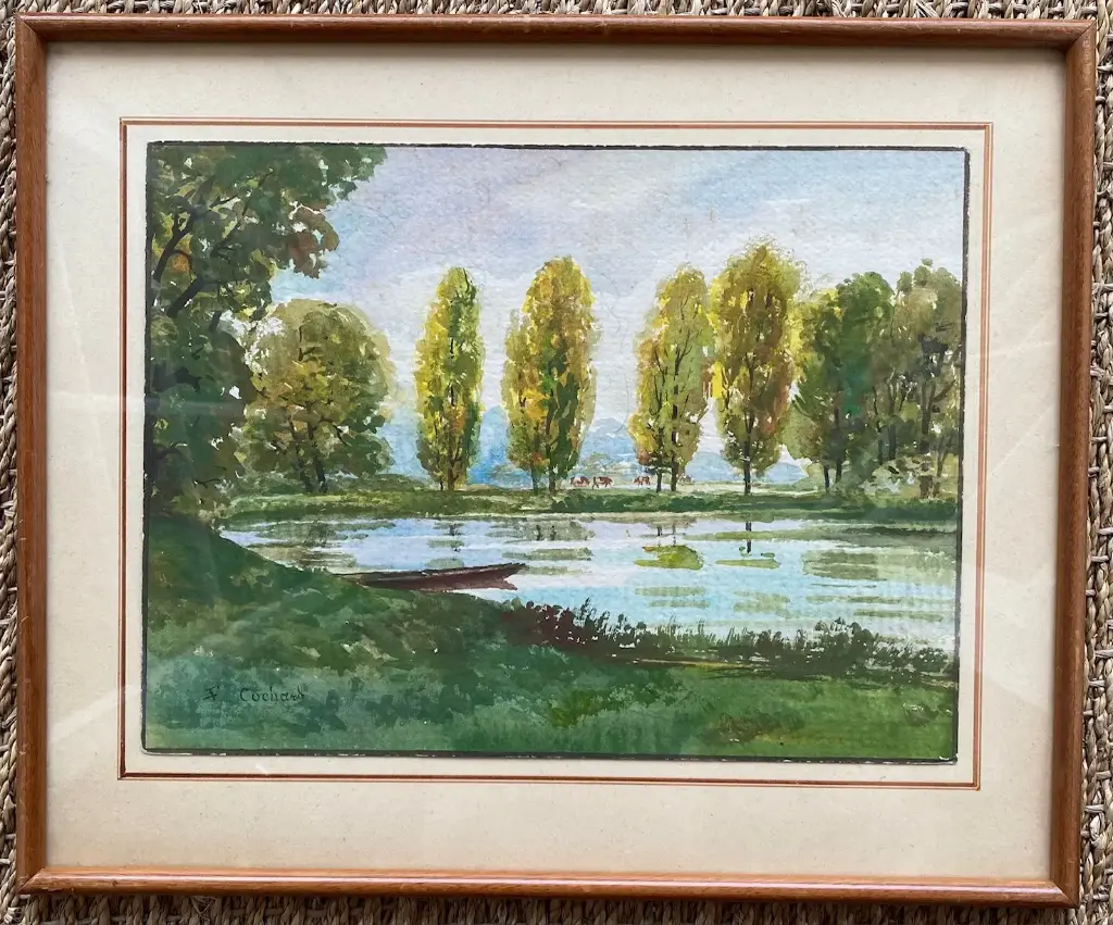 Aquarelle ancienne signée encadrée sous verre, début XXème, une barque au lac.                                                               Old signed watercolor framed under glass, early 20th century, a boat on the lake.