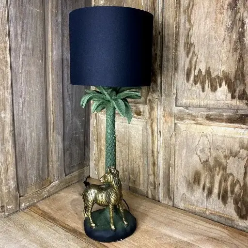 Lampe vintage,  Hollywood Regency, design Italien des années 70, résine au décors d'un zèbre et d'un palmier. Par Fascinato Milan.                                  Vintage lamp, Hollywood Regency, Italian design from the 70s, resin with zebra and palm tree decorations. By Fascinato Milan.